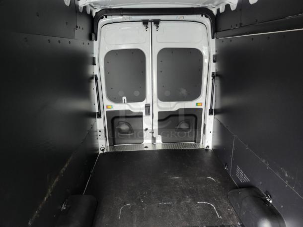 Cargo area of 2020 Ford Transit 350 Van, high roof, black wall liners, clean condition, ready for commercial use or conversion.