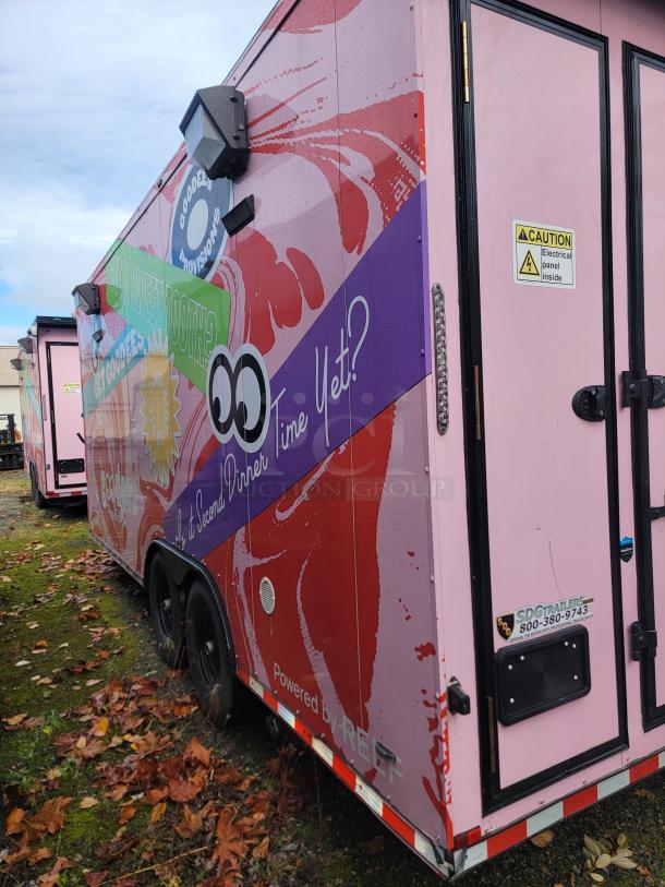 2021 SDG 8.5' x 20' food concession trailer with eye-catching wrap. Features tandem axles, caution sign, and SDG branding.