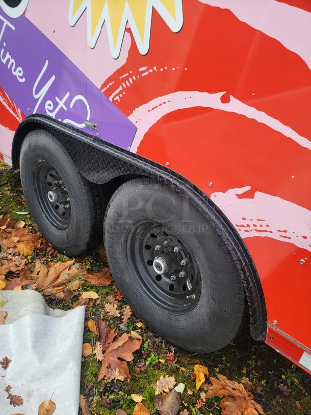 2021 SDG 20' Merchandise Trailer with vibrant wrap and tandem axle, ready for high-volume dessert sales.