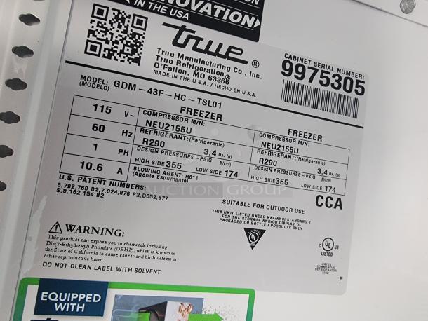 Label on a True Manufacturing freezer, model GDM-43F-HC-TSL01, with specs including refrigerant R290, 115V, 60Hz, and warnings.
