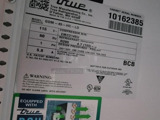 True Manufacturing Co. refrigeration unit label showing model GDM-45-HC-LD, refrigerant R290, and cabinet serial number 10162385.
