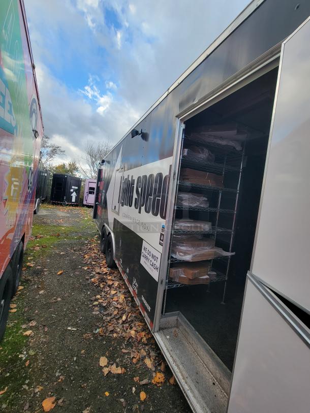 2021 24' Diamond Cargo Mobile Kitchen Trailer, equipped with True Refrigeration units, Bakers Pride oven, stainless steel counters.