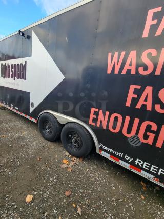 24' Diamond Cargo trailer, 2021 model, black exterior with branding, dual axles, ready for mobile kitchen use.