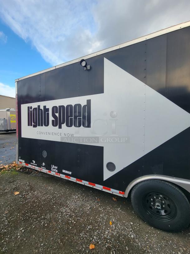 2021 Diamond 24' mobile kitchen trailer with "light speed" decal. Equipped for commercial food operations. Turnkey condition.