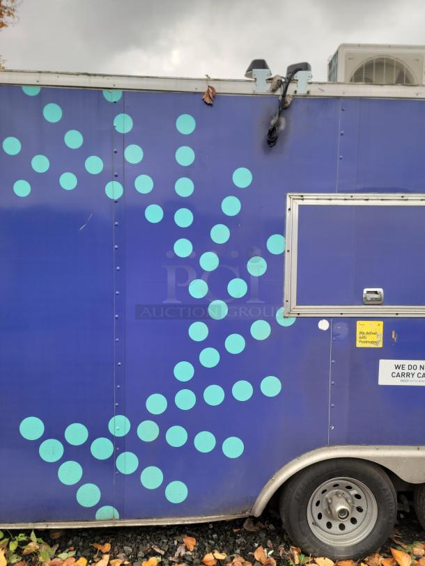 2019 Rock Solid Cargo 24' food trailer, blue with polka dots, side window, and stickers. Ideal for turnkey kitchen use.
