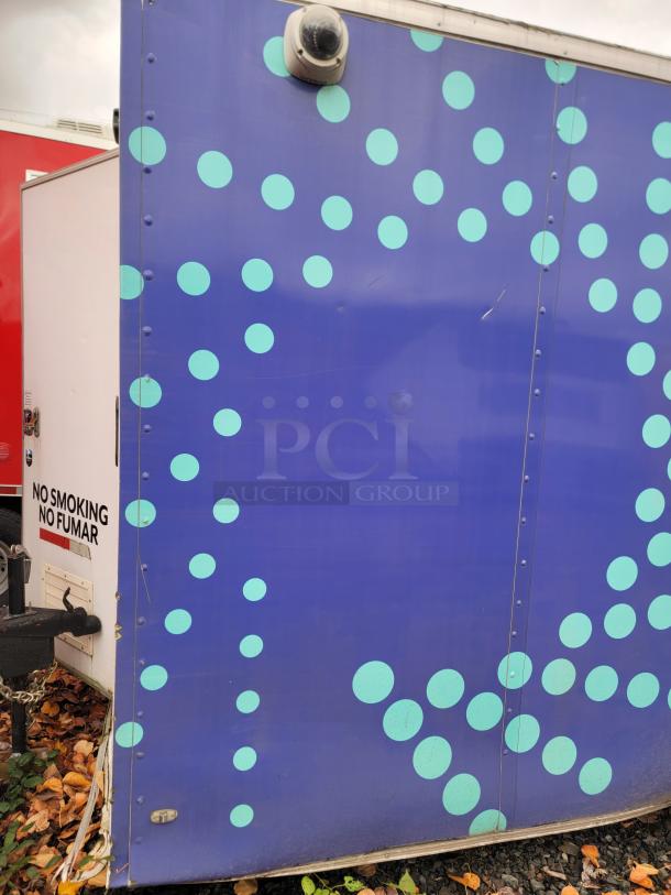2019 Rock Solid Cargo food trailer side, blue with polka dots. "No Smoking" sign visible. Equipped for commercial use.