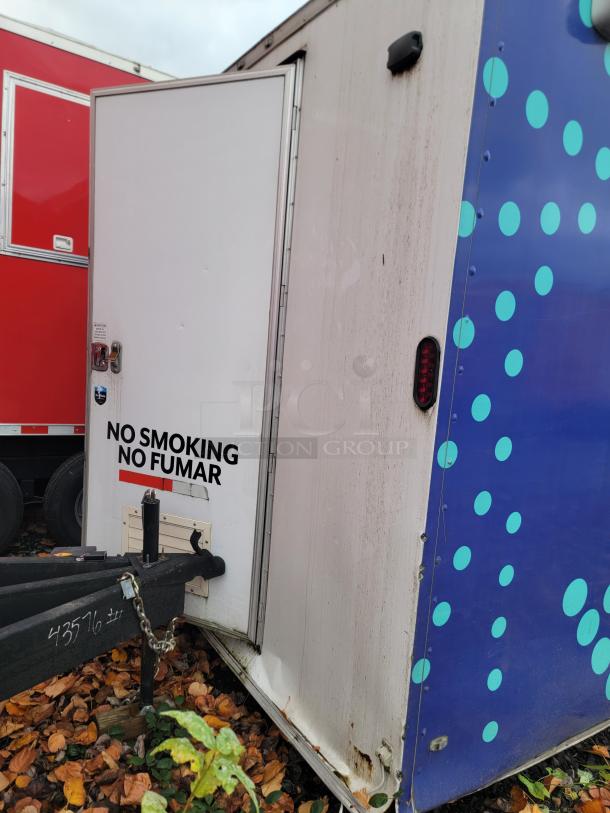 2019 Rock Solid Cargo 24' food trailer, "No Smoking" label, blue polka dot design, some exterior wear visible.