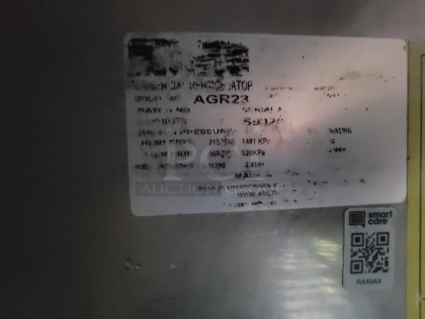 Label on Arctic Air refrigerator model AGR23, showing specifications and QR code for smart care.