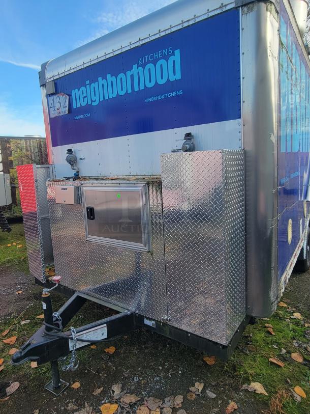 2021 Quality 16-Foot Kitchen Trailer, dual-axle, blue and silver finish, marked "neighborhood kitchens," excellent condition.