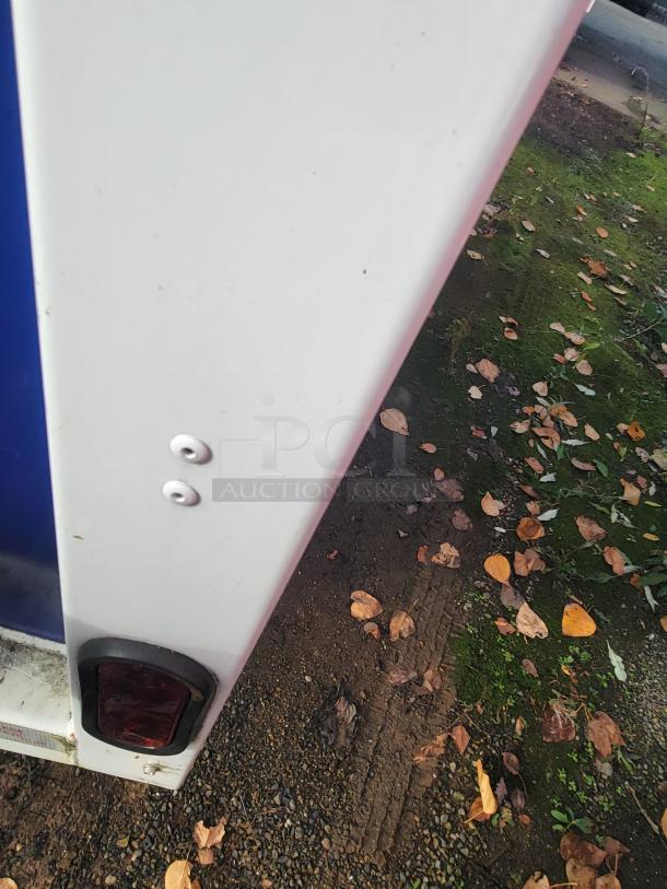 2021 Quality 16-Foot Commercial Kitchen Trailer rear detail; blue and white exterior, dual-axle, ready for high-volume use.