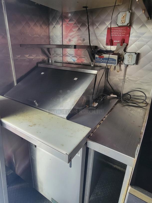 2021 Quality 16-Foot Commercial Kitchen Vessel interior featuring stainless steel surfaces and utility outlets, ideal for catering.