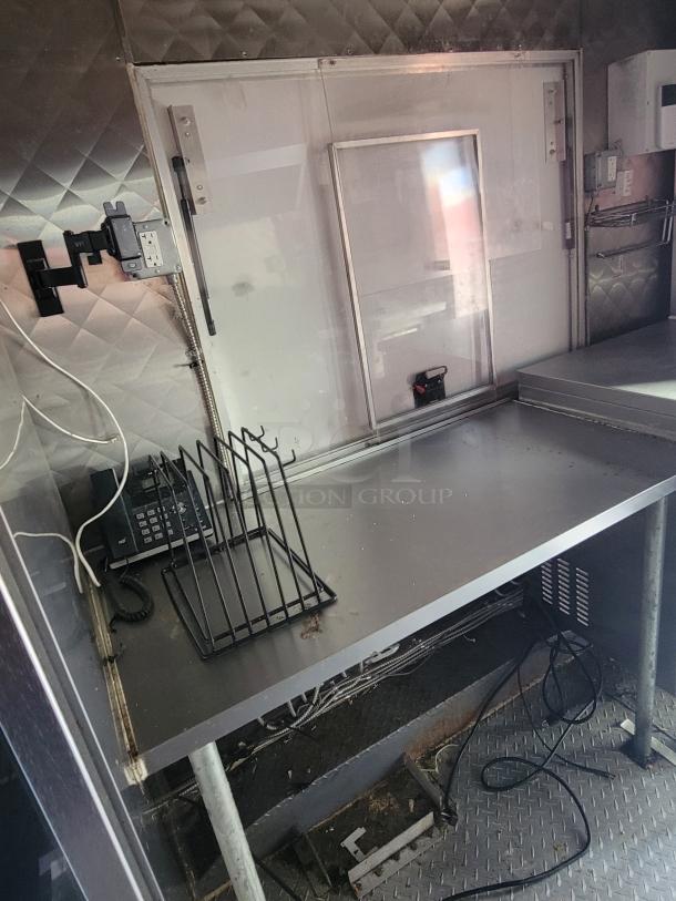 2021 Quality 16-foot commercial kitchen vessel, stainless steel interior, dual-axle, phone and rack visible.