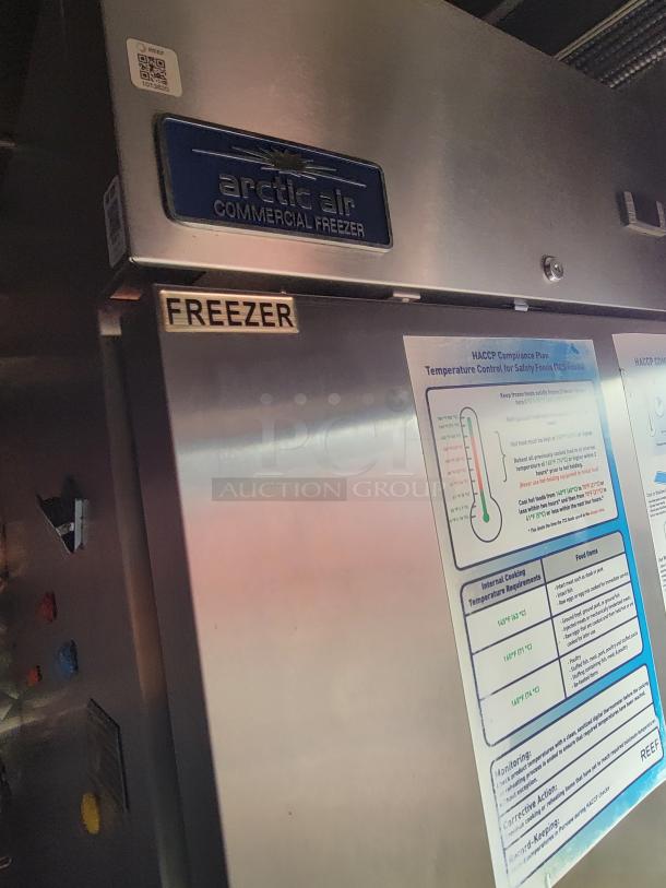 Arctic Air commercial freezer inside a 2021 Quality Food Trailers kitchen vessel. Visible HACCP compliance info.