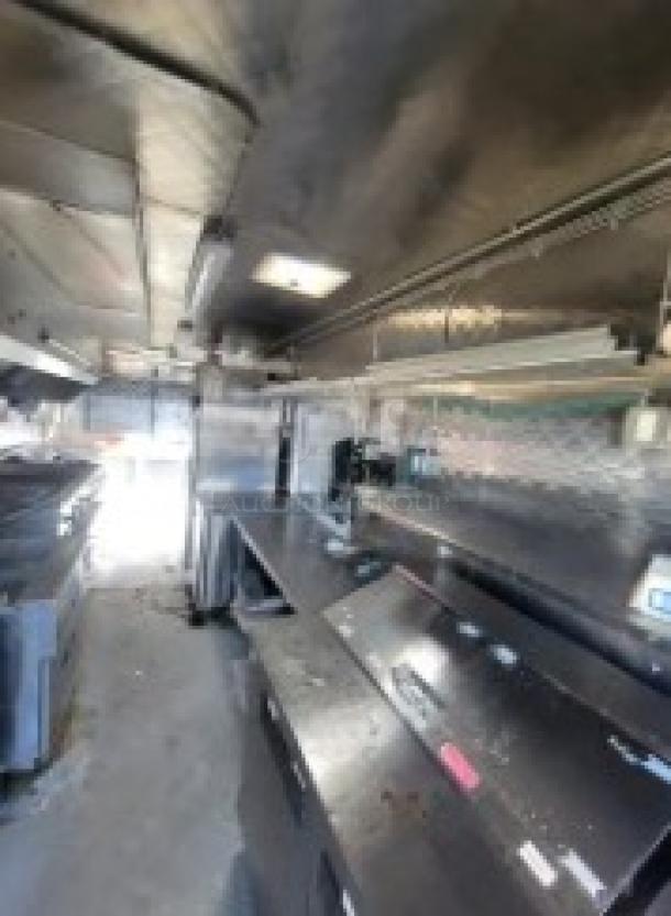 Professional-grade 24' Quality Model mobile kitchen trailer, fully equipped with commercial appliances and fire suppression system.