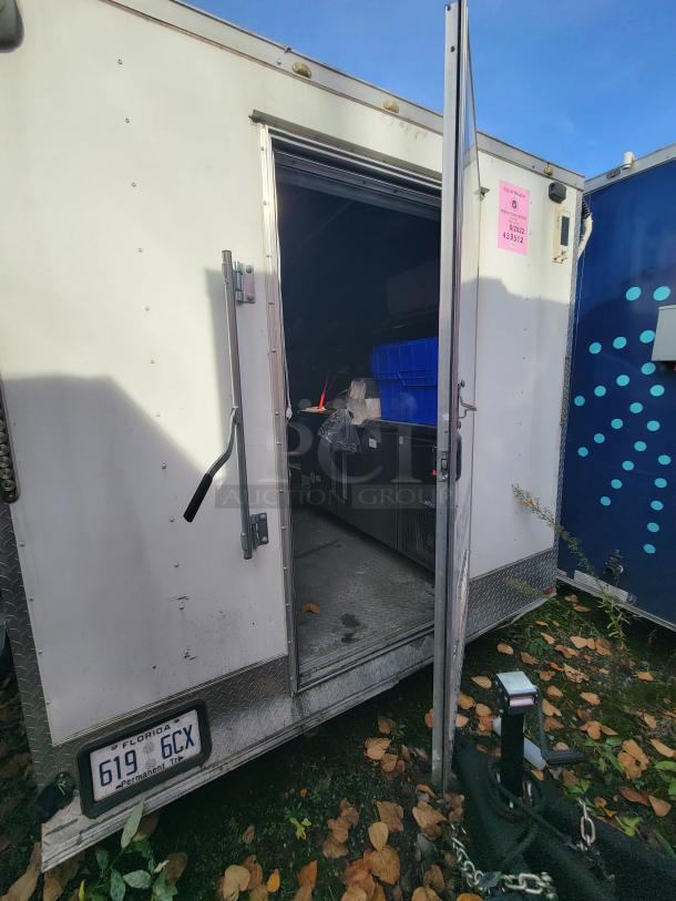 2019 Quality 24' food concession trailer with rear open door. Visible interior includes commercial-grade kitchen equipment.