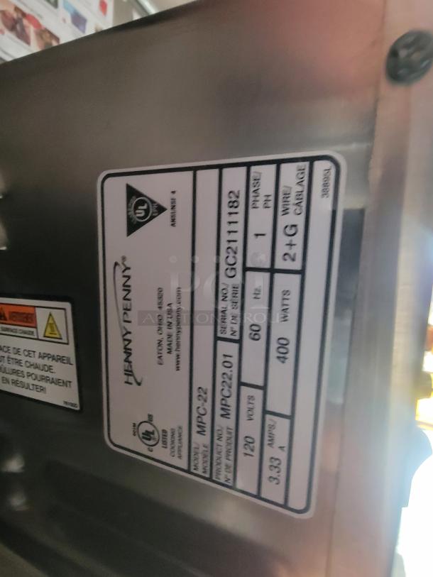 Label on equipment reads "Henny Penny MPC-22," indicating model and specifications.