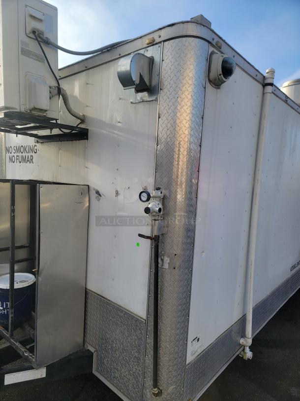 2019 Quality 24' food concession trailer with stainless steel exterior, dual refrigeration, and safety features.