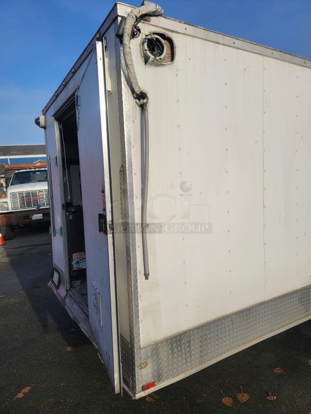 2019 Quality 24' food concession trailer, heavy-duty chassis, open doorview. Fully equipped for commercial use, VIN visible.