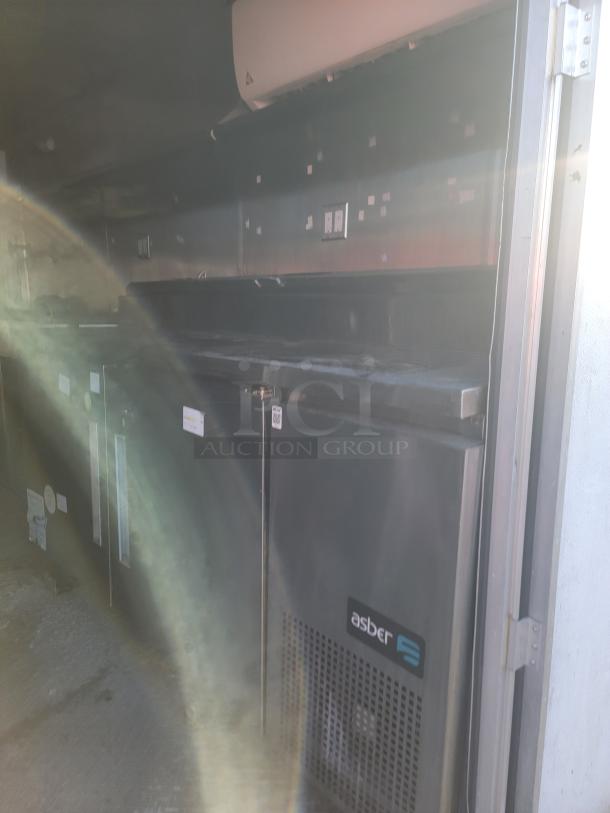2019 24' food concession trailer interior with stainless steel Asber refrigerator, prep table, and ProTex II fire system.
