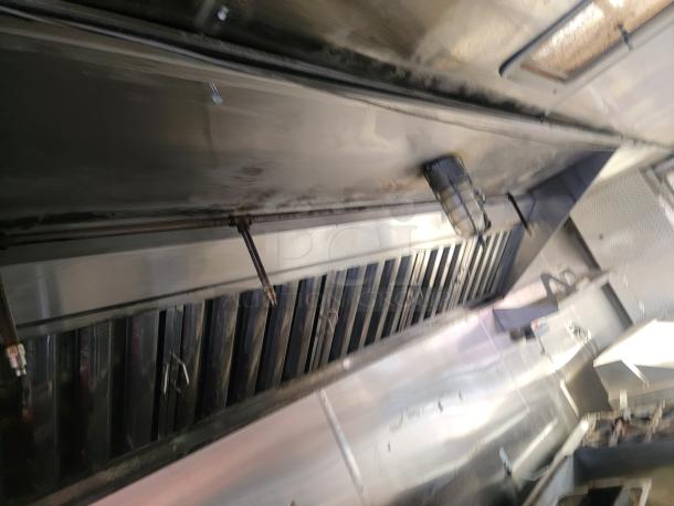 2019 Quality 24' food concession trailer interior, showing stainless steel surfaces and ProTex II fire suppression system.