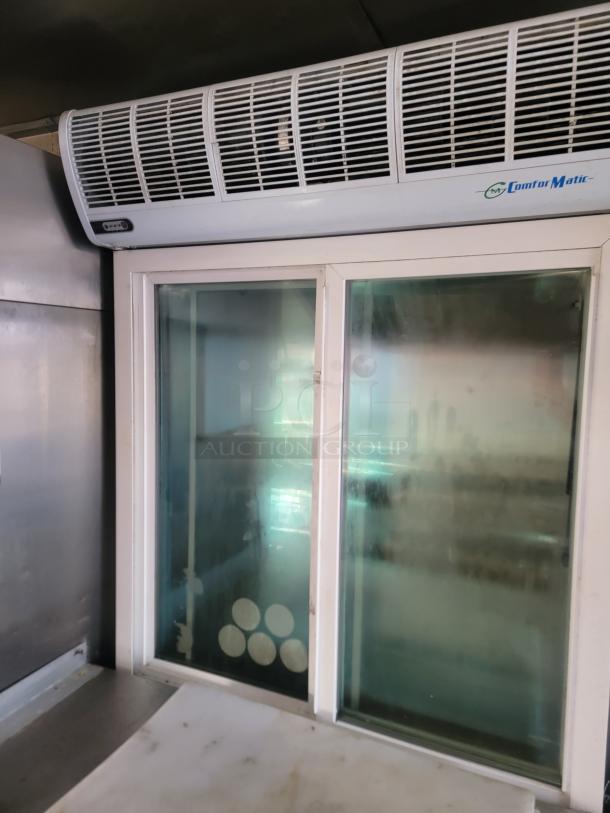 Interior of 2019 Quality 24' food concession trailer showing a Comfort Matic air unit and sliding service window.