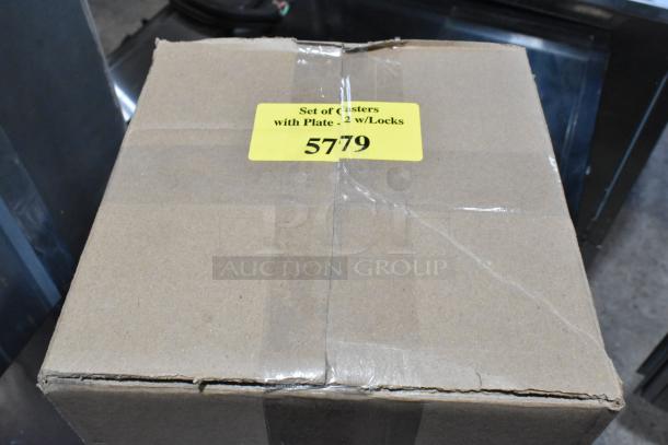 Cardboard box labeled "Set of casters with plate, 2 w/locks, 5779" on top, likely containing casters for the Blodgett ovens.
