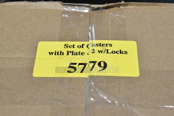 Yellow label reads: "Set of Casters with Plate - 2 w/Locks 5779" on cardboard box.