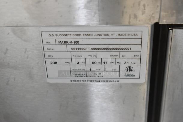 Blodgett MARK-V-100 stainless steel commercial convection oven label, showing model, serial number, 208V, 3-phase details.