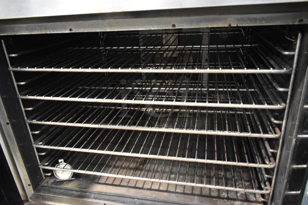 Vulcan VC6GD stainless steel convection oven interior with metal racks, view-through doors, and thermostatic controls.