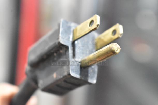 Close-up of a metal prong plug, part of Vulcan VC6GD commercial convection oven, electric-powered, emphasizing durability and connectivity.