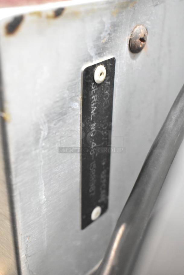 Serial plate of a Vulcan VC6GD commercial oven with visible model and serial numbers.