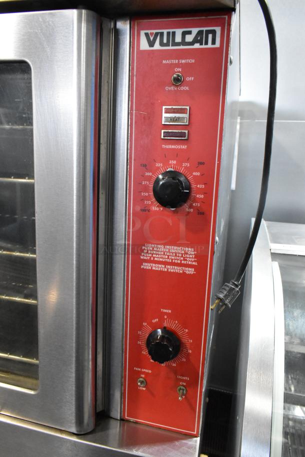 Vulcan VC6GD stainless steel electric convection oven with view-through doors, metal racks, and thermostatic controls.