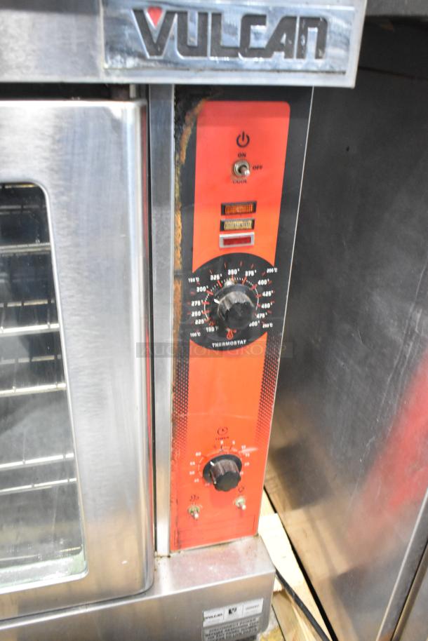 Vulcan VC6GD-SEFCAM stainless steel convection oven with view-through doors, metal racks, and thermostatic controls.