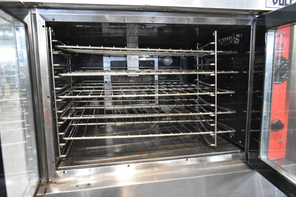 Vulcan VC6GD-SEFCAM stainless steel commercial convection oven with view-through doors, metal racks, and thermostatic controls.