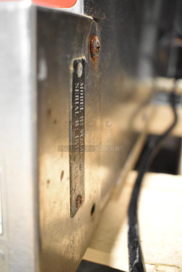 Vulcan VC6GD-SEFCAM convection oven label showing model and serial numbers, partially obscured by rust.