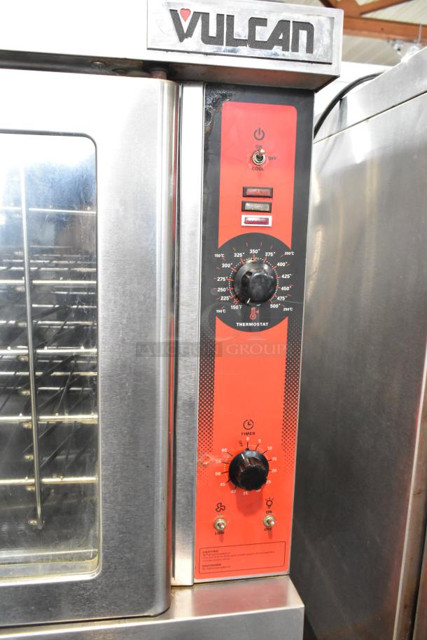 Vulcan VC6GD-SEFCAM stainless steel convection oven with view-through doors, metal racks, and thermostatic controls.