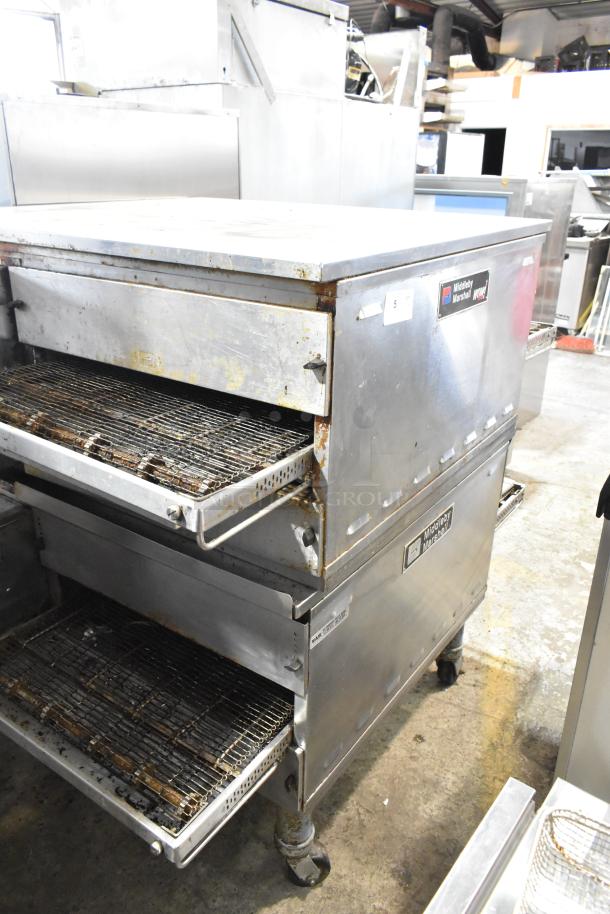 Two 2021 Middleby Marshall PS638G stainless steel conveyor pizza ovens on casters, natural gas, 89,000 BTU, used condition.