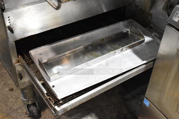 Middleby Marshall PS638G stainless steel conveyor pizza oven, used, on casters. Natural gas, 89,000 BTU, commercial condition.