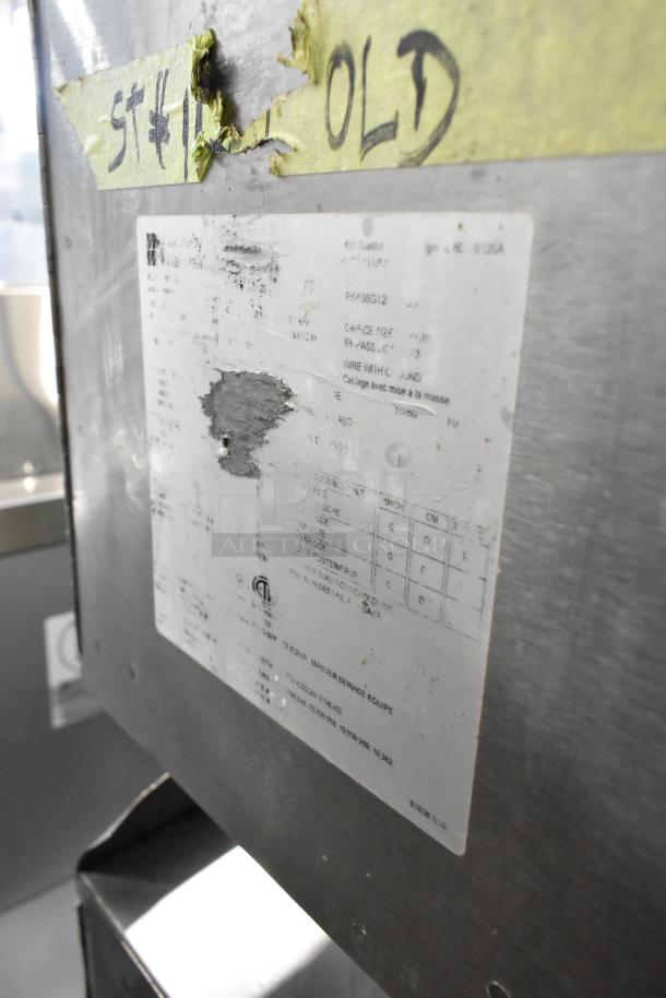 Middleby Marshall PS638G stainless steel conveyor pizza oven label, displaying model and specs. Visible wear on metal surface.