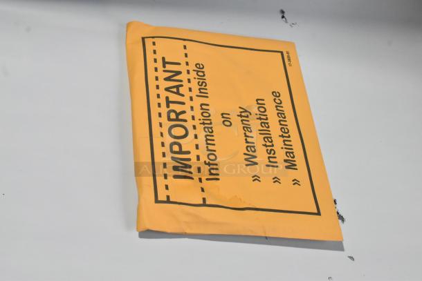 Yellow envelope labeled "Important - Information Inside on Warranty, Installation, Maintenance."
