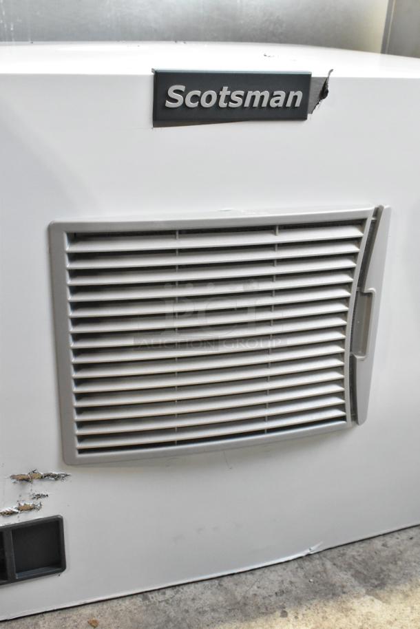 Brand new Scotsman MC0330MA-1A ice machine, 30", 400 lb capacity, showing minor dents. Model and brand label visible.