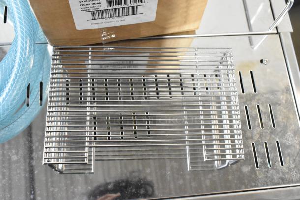 Brand new Estella ECEM2 stainless steel commercial two-group automatic espresso machine, featuring 3 portafilters and steam wands.