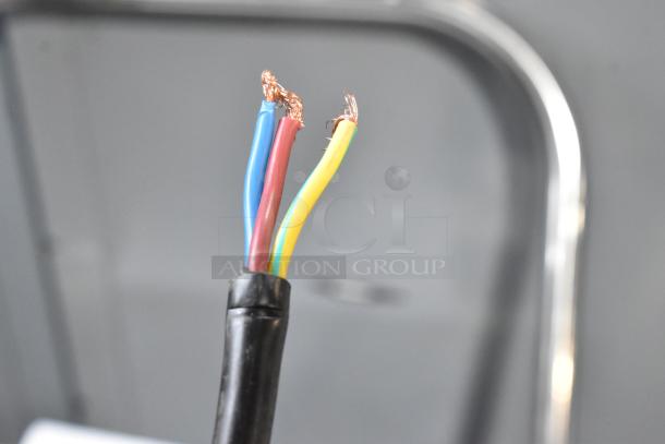 Alt text: Close-up of exposed wires with copper showing in a damaged cable.