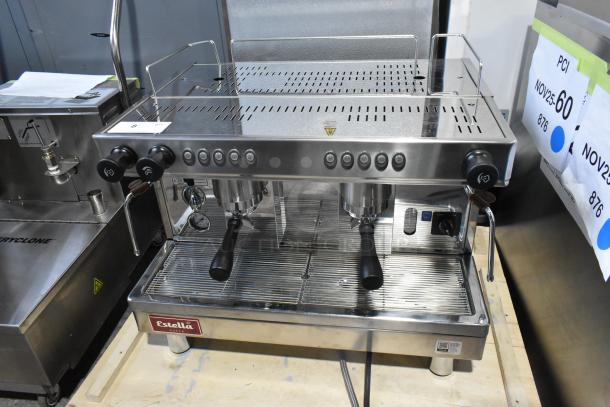 Estella ECEM2 stainless steel two-group automatic espresso machine, includes 3 portafilters and steam wands, new condition.