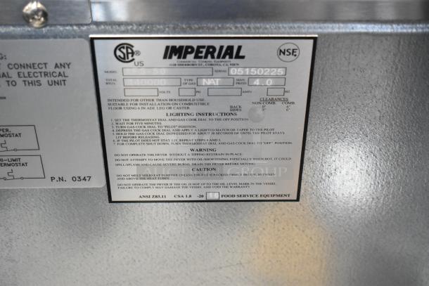 "Imperial IFS-50 fryer label showing model, natural gas type, 140,000 BTU, and safety instructions for commercial use."