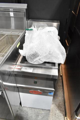 Brand new Avantco 177EF40B stainless steel electric deep fat fryer with two metal baskets, partially wrapped. Scratch and dent condition.