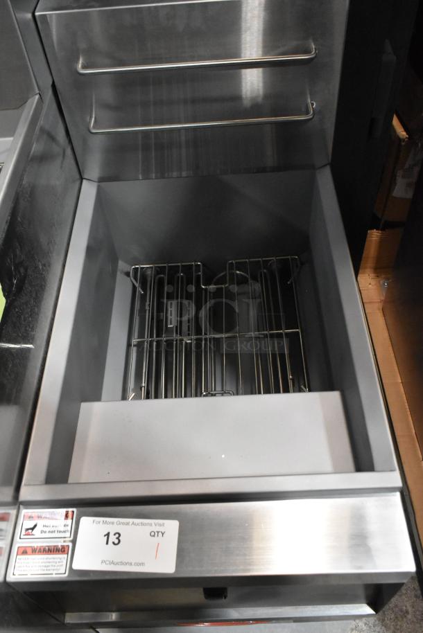 Brand new Avantco 177EF40B electric fryer, stainless steel, with 2 metal fry baskets. 208V, 1 phase, floor style, minor scratch and dent.