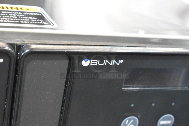 BRAND NEW 2025 Bunn Axiom Twin APS coffee brewer, stainless steel, 120/240V, with minor scratches, hot water dispenser.