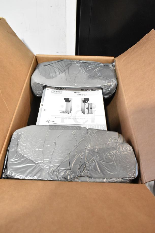 Brand new 2023 Fetco TBS-2121 iced tea brewer in box, stainless steel, 120V, minor scratch and dent, includes user guide.