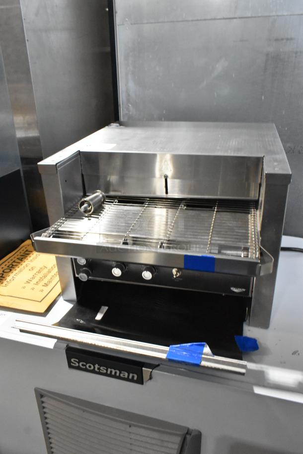 Brand new Vollrath JT2000 stainless steel commercial conveyor toaster with 1 1/2" opening; minor scratches, 240V, 1 phase.